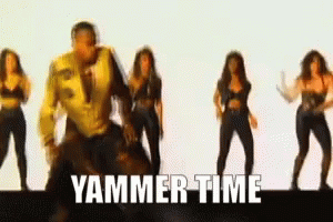 A Man In A Yellow Jacket Is Surrounded By Women Dancing And The Words Yammer Time Are Visible GIF