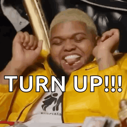 A Man In A Yellow Jacket With The Words Turn Up Written On His Face GIF