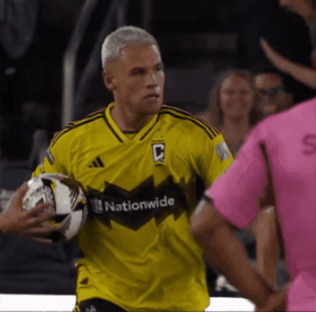 A Man In A Yellow Jersey That Says Nationwide GIF