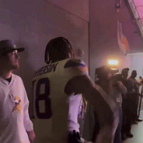 A Man In A Yellow Jersey With The Number 18 On The Back GIF