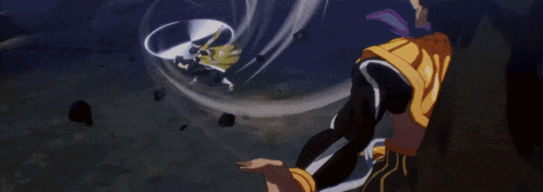 A Man In A Yellow Kimono With Chinese Writing On It Is Laying Down GIF
