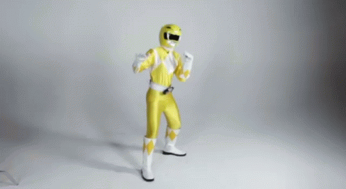 A Man In A Yellow Power Ranger Costume Is Dancing GIF