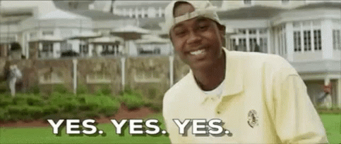 A Man In A Yellow Shirt And Hat Is Smiling And Says `` Yes . Yes . Yes . '' GIF