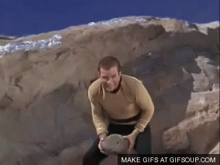 A Man In A Yellow Shirt Is Holding A Basketball Over His Head .. GIF