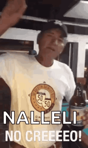 A Man In A Yellow Shirt Is Holding A Bottle Of Beer And Saying Nalleli No Creeeeeo . GIF