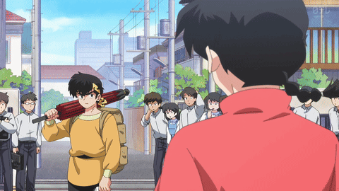 A Man In A Yellow Shirt Is Holding A Red Umbrella GIF