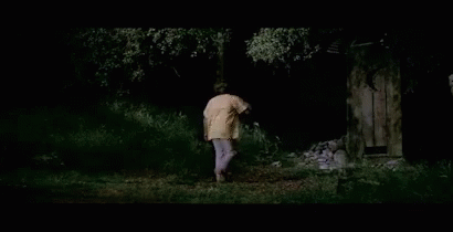 A Man In A Yellow Shirt Is Walking Through A Dark Forest With The Words " It 'S Those Damn Enchiladas " Above Him GIF