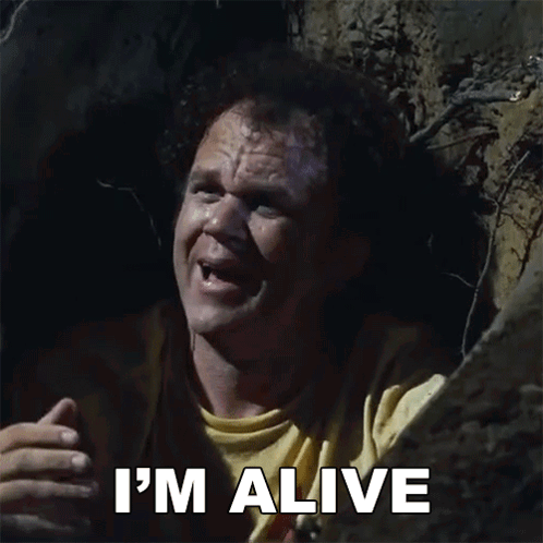 A Man In A Yellow Shirt Says I 'M Alive In A Cave GIF