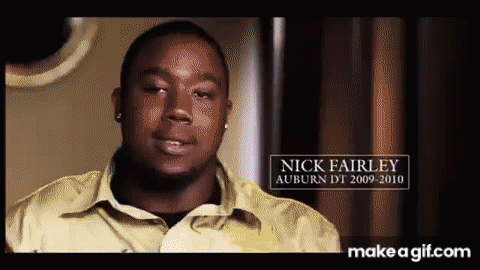 A Man In A Yellow Shirt With The Name Nick Fairley GIF