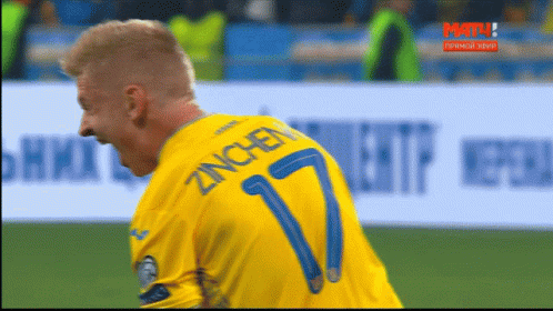 A Man In A Yellow Shirt With The Number 7 On The Back GIF