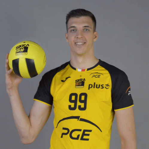 A Man In A Yellow Shirt With The Number 99 On It Holds A Yellow Ball GIF