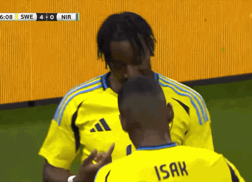 a man in a yellow shirt with the word isak on it