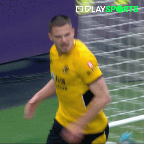 A Man In A Yellow Shirt With The Word Play Sports On The Bottom Right GIF
