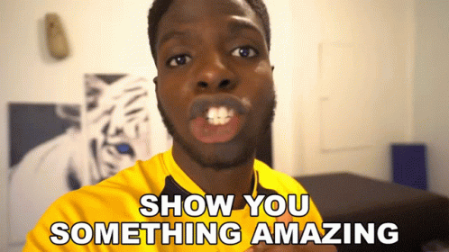 a man in a yellow shirt with the words show you something amazing behind him