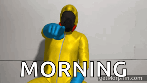 A Man In A Yellow Suit And Blue Gloves Points To The Word Morning GIF