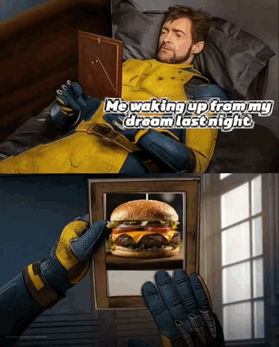 A Man In A Yellow Suit Is Laying In Bed Looking At A Picture Of A Hamburger In A Picture Frame GIF