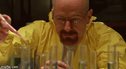 A Man In A Yellow Suit Is Pouring Liquid Into Test Tubes . GIF