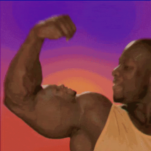A Man In A Yellow Tank Top Flexes His Arm GIF