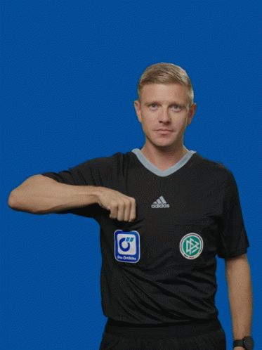 A Man In An Adidas Shirt Is Holding A Yellow Card GIF