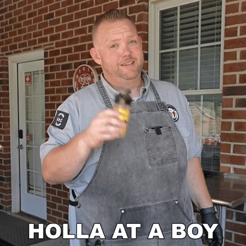 A Man In An Apron Is Holding A Bottle And The Words Holla At A Boy Are Below Him GIF