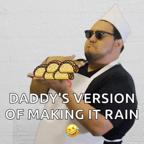 A Man In An Apron Is Holding A Bunch Of Tacos And The Caption Says Daddy 'S Version Of Making It Rain GIF