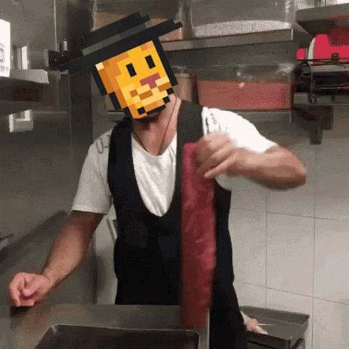 a man in an apron is holding a piece of meat