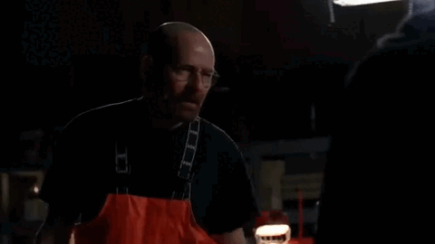 A Man In An Apron Is Screaming In A Dark Room With The Word Done Written On The Screen . GIF