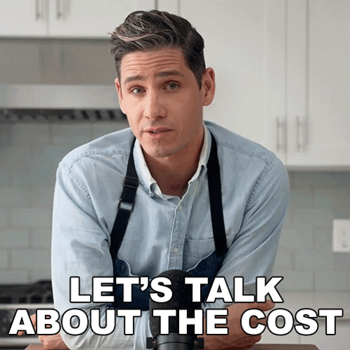 A Man In An Apron With The Words Let 'S Talk About The Cost Behind Him GIF