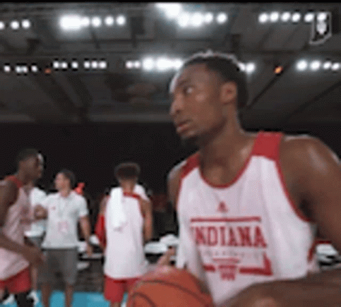 A Man In An Indiana Jersey Holds A Basketball In His Hands GIF