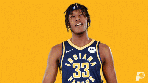 A Man In An Indiana Pacers Jersey Flexing His Muscles GIF