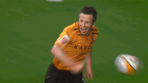 A Man In An Orange Jacket With A Crown Logo On His Arm GIF