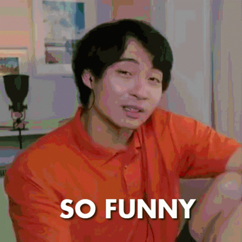 A Man In An Orange Shirt Is Making A Funny Face With The Words So Funny Below Him GIF