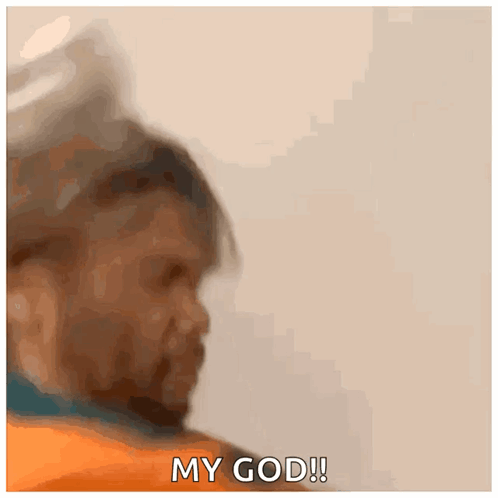 A Man In An Orange Shirt Is Saying My God ! GIF