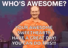 A Man In An Orange Shirt Is Standing On A Stage With His Hands On His Hips And Says `` Who 'S Awesome ? '' GIF