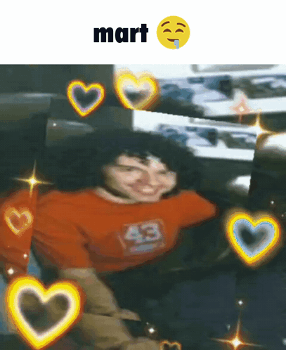 Man In Orange Shirt Surrounded By Hearts GIF