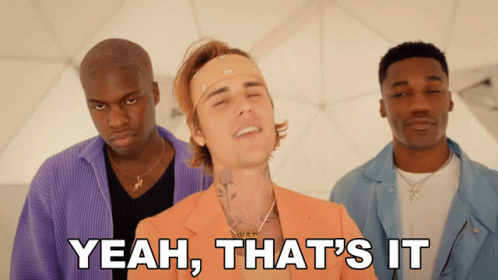 A Man In An Orange Suit Is Surrounded By Two Other Men With Yeah That 'S It Written Below Him GIF