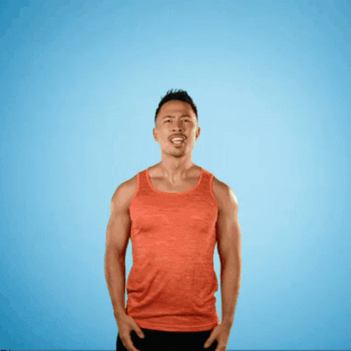a man in an orange tank top is screaming in front of a blue background with the word et 's on it