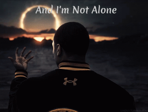 A Man In An Under Armour Jacket Looks At A Sunset GIF