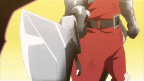 A Man In Armor Is Holding A Large Sword And Shield GIF