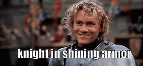 a man in armor is smiling with the words `` knight in shining armor '' written above him .