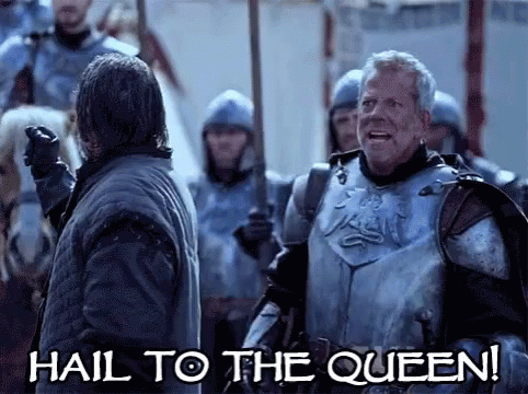 A Man In Armor Says Hail To The Queen While Standing Next To Another Man GIF