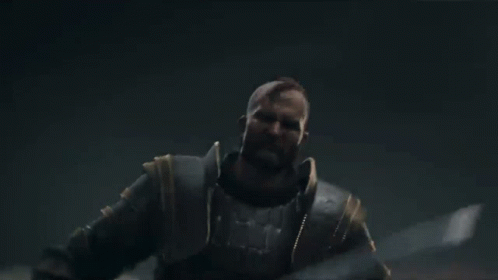 a man in armor with his arms outstretched in the air