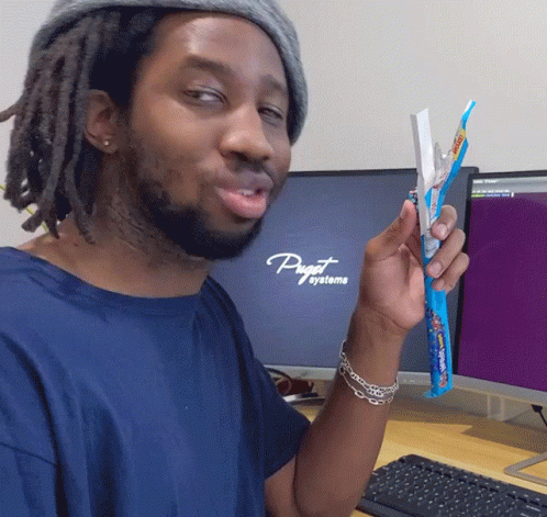 A Man In Front Of A Computer That Says Puget Systeme GIF