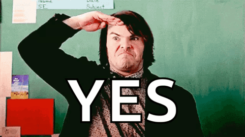 A Man In Front Of A Green Chalkboard With The Word Yes On It GIF