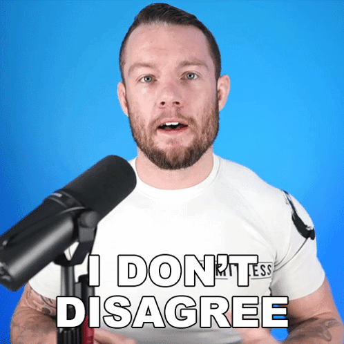 A Man In Front Of A Microphone Says I Don T Disagree GIF