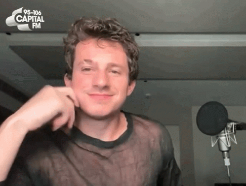 A Man In Front Of A Microphone With 95-106 Capital Fm Written On The Top GIF