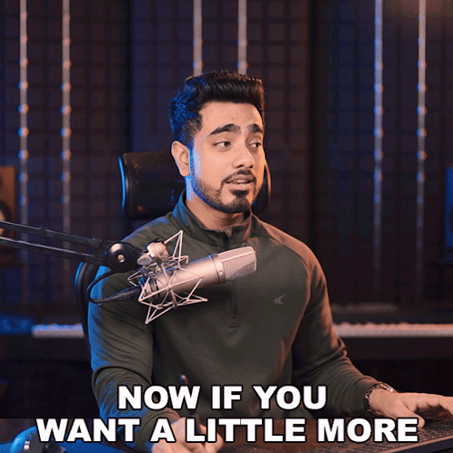 A Man In Front Of A Microphone With The Words Now If You Want A Little More Below Him GIF