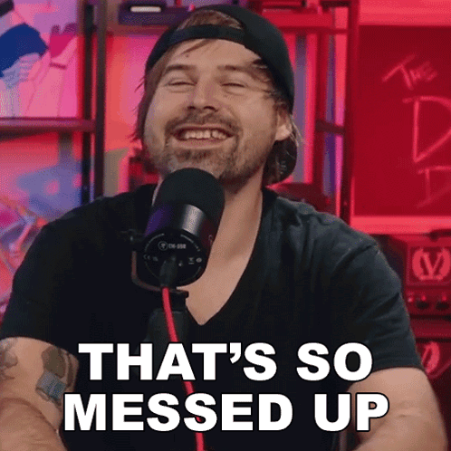 A Man In Front Of A Microphone With The Words That 'S So Messed Up Behind Him GIF