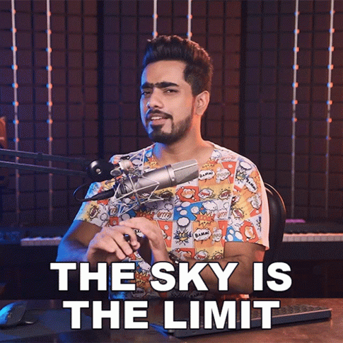 A Man In Front Of A Microphone With The Words The Sky Is The Limit GIF