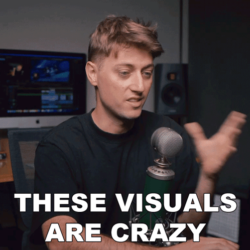 A Man In Front Of A Microphone With The Words These Visuals Are Crazy GIF